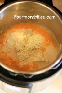 Adding cream, mozzarella cheese, Parmesan cheese, sea salt and pepper to instant pot chicken spaghetti