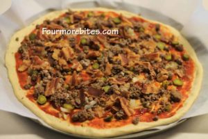 Add the ground beef and bacon to the bacon cheeseburger pizza