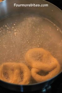 Boiling homemade soft pretzel dough