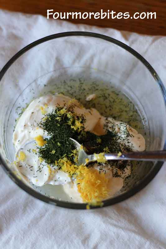 Creamy dill sauce ingredients ready to to mixed up to be served with baked crab cakes