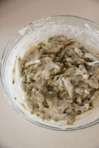 Green beans mixed with cream of mushroom soup, heavy cream and seasoning.