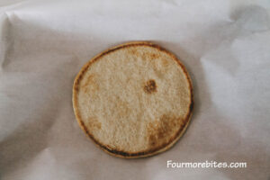 Flatbread on parchment lined cookie sheet